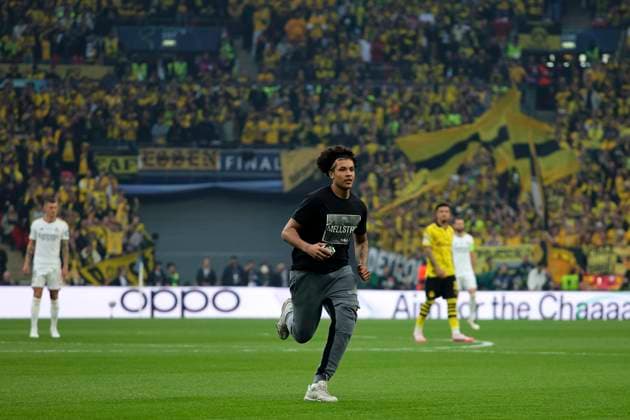A pitch invader wearing a T-shirt with mellstrom written on it during the 2023 2024 Champions League Final football match between Borussia Dortmund and Real Madri CF at Wembley stadium in London (England), June 1st, 2024. cesarexpurini