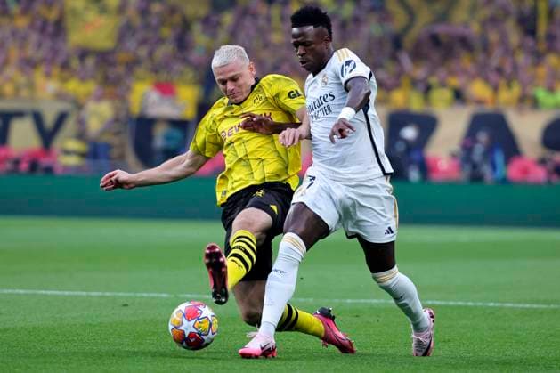 Julian Ryerson of Borussia Dortmund and Vinicius Junior of Real Madrid CF compete for the ball during the 2023 2024 Champions League Final football match between Borussia Dortmund and Real Madri CF at Wembley stadium in London (England), June 1st, 2024. cesarexpurini