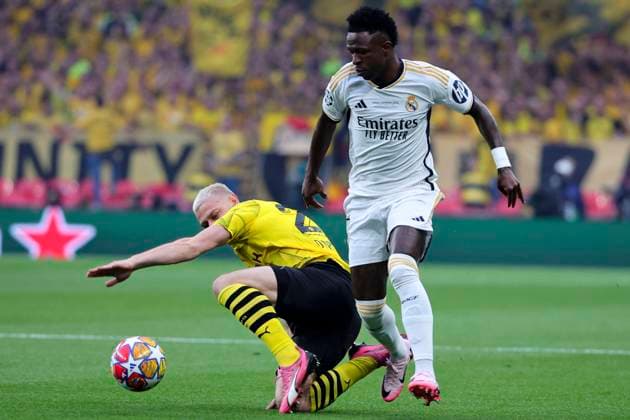Julian Ryerson of Borussia Dortmund and Vinicius Junior of Real Madrid CF compete for the ball during the 2023 2024 Champions League Final football match between Borussia Dortmund and Real Madri CF at Wembley stadium in London (England), June 1st, 2024. cesarexpurini