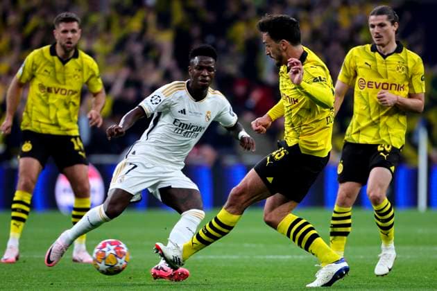 Vinicius Junior of Real Madrid CF and Mats Hummels of Borussia Dortmund during the 2023 2024 Champions League Final football match between Borussia Dortmund and Real Madri CF at Wembley stadium in London (England), June 1st, 2024. cesarexpurini