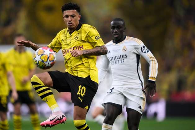 Borussia Dortmund v Real Madrid CF - UEFA Champions League Jadon Sancho of Borussia Dortmund competes for the ball with Ferland Mendy of Real Madrid CF during the UEFA Champions League final football match between Borussia Dortmund and Real Madrid CF. London United Kingdom Copyright: xNicolòxCampox