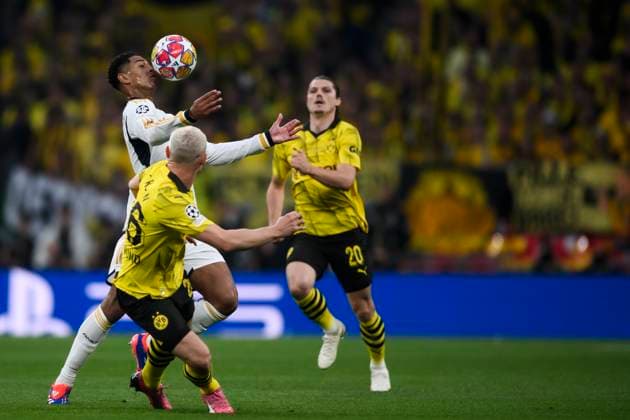 Borussia Dortmund v Real Madrid CF - UEFA Champions League Jude Bellingham of Real Madrid CF competes for the ball with Julian Ryerson and Marcel Sabitzer of Borussia Dortmund during the UEFA Champions League final football match between Borussia Dortmund and Real Madrid CF. London United Kingdom Copyright: xNicolòxCampox