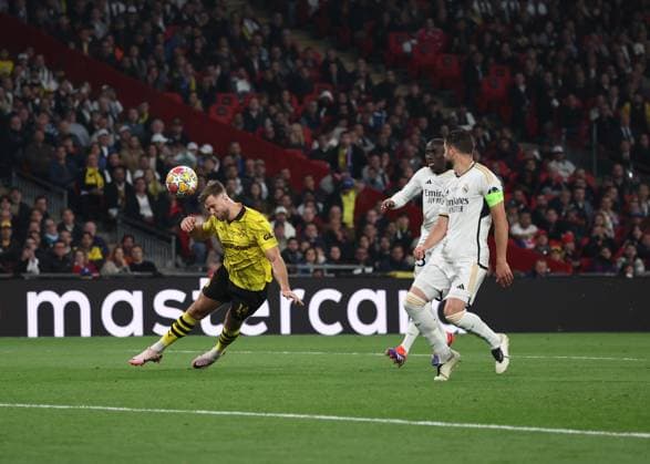 London, England, 1st June 2024. Niclas FuÌˆllkrug of Borussia Dortmund directs a header which is saved by Thibaut Courtois of Real Madrid during the UEFA Champions League final match at Wembley Stadium, London. Picture credit should read: David Klein Sportimage EDITORIAL USE ONLY. No use with unauthorised audio, video, data, fixture lists, club league logos or live services. Online in-match use limited to 120 images, no video emulation. No use in betting, games or single club league player publications. SPI-3169-0108