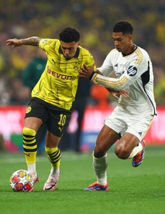 Jadon Sancho of Borussia Dortmund (L) battles with Jude Bellingham of Real Madrid (R) Borussia Dortmund v Real Madrid, UEFA Champions League, Final, Football, Wembley Stadium, London, UK - 01 June 2024 EDITORIAL USE ONLY No use with unauthorised audio, video, data, fixture lists, club league logos or live services. Online in-match use limited to 120 images, no video emulation. No use in betting, games or single club league player publications. Copyright: xKieranxMcManus Shutterstockx 14516313bu