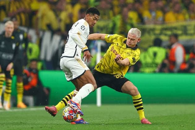Jude Bellingham of Real Madrid battles with Julian Ryerson of Borussia Dortmund Borussia Dortmund v Real Madrid, UEFA Champions League, Final, Football, Wembley Stadium, London, UK - 01 June 2024 EDITORIAL USE ONLY No use with unauthorised audio, video, data, fixture lists, club league logos or live services. Online in-match use limited to 120 images, no video emulation. No use in betting, games or single club league player publications. Copyright: xKieranxMcManus Shutterstockx 14516313bv
