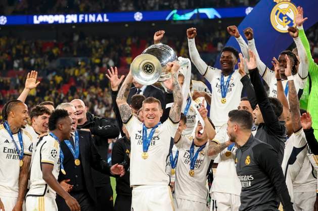 Toni Kroos (Real Madrid) holds up the trophy for winning the Champions League and cheers with his teammates and coach Carlo Ancelotti (Real Madrid) during the award ceremony, UEFA Champions League 2023 24 - Final, Borussia Dortmund vs Real Madrid CF, Wembley Stadium, June 1, 2024, London, United Kingdom.