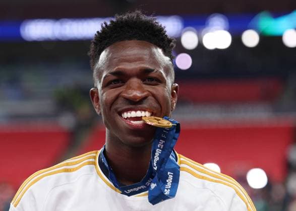 London, England, 1st June 2024. Vinicius Junior of Real Madrid shows his medal during the UEFA Champions League final match at Wembley Stadium, London. Picture credit should read: David Klein Sportimage EDITORIAL USE ONLY. No use with unauthorised audio, video, data, fixture lists, club league logos or live services. Online in-match use limited to 120 images, no video emulation. No use in betting, games or single club league player publications. SPI-3169-0140