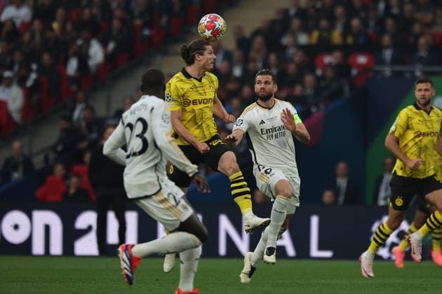 LONDON, ENGLAND, JUNE 01: Marcel Sabitzer (top) of Borussia Dortmund is heading the ball during the UEFA Champions League final soccer match between Borussia Dortmund and Real Madrid at Wembley Stadium in London, England on June 01, 2024, UEFA Champions League Final - Borussia Dortmund v Real Madrid