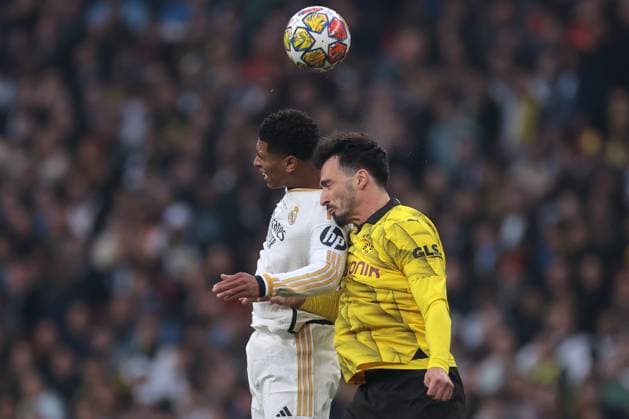 London, England, 1st June 2024. Jude Bellingham of Real Madrid and Mats Hummels of Borussia Dortmund battle for an aerial ball during the UEFA Champions League match at Wembley Stadium, London. Picture credit should read: Jonathan Moscrop Sportimage EDITORIAL USE ONLY. No use with unauthorised audio, video, data, fixture lists, club league logos or live services. Online in-match use limited to 120 images, no video emulation. No use in betting, games or single club league player publications. SPI-3168-0012