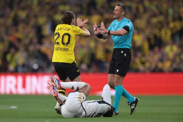 London, England, 1st June 2024. Marcel Sabitzer of Borussia Dortmund reacts towards the Referee Slavko Vincic of Slovenia after upending Jude Bellingham of Real Madrid during the UEFA Champions League match at Wembley Stadium, London. Picture credit should read: Jonathan Moscrop Sportimage EDITORIAL USE ONLY. No use with unauthorised audio, video, data, fixture lists, club league logos or live services. Online in-match use limited to 120 images, no video emulation. No use in betting, games or single club league player publications. SPI-3168-0037