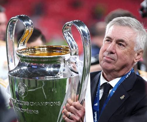 (240602) -- LONDON, June 2, 2024 -- Real Madrid s head coach Carlo Ancelotti celebrates with the trophy after winning the UEFA Champions League final match between Real Madrid and Borussia Dortmund in London, Britain, June 1, 2024. ) (SP)SPAIN-MADRID-FOOTBALL-UEFA CHAMPIONS LEAGUE-FINAL- REAL MADRID VS DORTMUND Str 