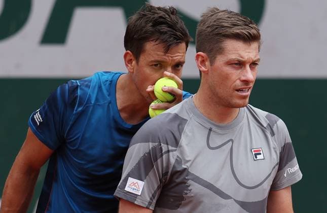 (240602) -- PARIS, June 2, 2024 -- Andras Mies (L) Neal Skupski are seen during the men s doubles first round match between Zhang Zhizhen (China) Tomas Machac (the Czech Republic) and Andras Mies (Germany) Neal Skupski (Britain) at the French Open tennis tournament at Roland Garros in Paris, France, June 2, 2024. ) (SP)FRANCE-PARIS-TENNIS-FRENCH OPEN-MEN S DOUBLES GaoxJing 