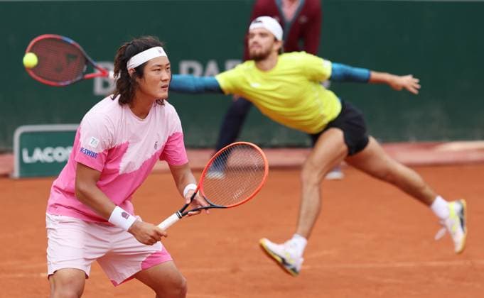 (240602) -- PARIS, June 2, 2024 -- Zhang Zhizhen (L) Tomas Machac compete during the men s doubles first round match between Zhang Zhizhen (China) Tomas Machac (the Czech Republic) and Andras Mies (Germany) Neal Skupski (Britain) at the French Open tennis tournament at Roland Garros in Paris, France, June 2, 2024. ) (SP)FRANCE-PARIS-TENNIS-FRENCH OPEN-MEN S DOUBLES GaoxJing 