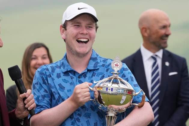 June 2, 2024, Hamilton, On, CANADA: Scotland s Robert MacIntyre laughs as a reporter asks him about his father and caddie, Dougie MacIntyre s share of the purse while holding the championship trophy after winning the Canadian Open golf tournament in Hamilton, Ontario on Sunday June 2, 2024. Canada News - June 2, 2024  - ZUMAc35_ 20240602_zaf_c35_125 Copyright: xFrankxGunnx