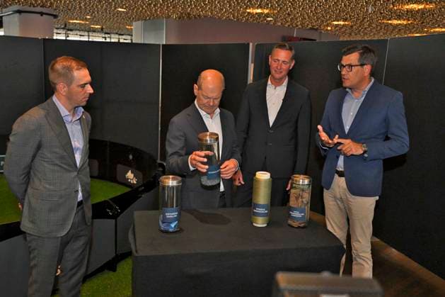 03 06 2024, European Football Championship 2024, Visit by Federal Chancellor Olaf Scholz to the European Championship stadium in Munich Football Arena f l European Championship Ambassador Philipp Lahm Germany , Federal Chancellor Olaf Scholz Germany look at the grass pellets