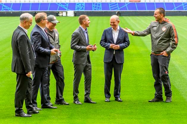 GER, Press event with Olaf Scholz Federal Chancellor of the Federal Republic of Germany in the Munich Allianz Arena which will be renamed Football Arena Munich during UEFA Euro 2024 03 06 2024, Allianz Arena, Munich, GER, Press event with Olaf Scholz Federal Chancellor of the Federal Republic of Germany in the Munich Allianz Arena which will be renamed Football Arena Munich during UEFA Euro 2024 , in the picture Olaf Scholz Federal Chancellor of the Federal Republic of Germany with Philipp Lahm and a greenkeeper of FC Bayern Jürgen Muth and Jan Christian Dreesen nordphotoxGmbHx xStraubmeier nph00004