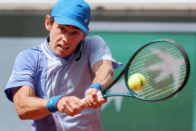 Alex de Minaur of Australia plays against Daniil Medvedev of Russia during their round-of-16 match of the French Tennis Open at Roland Garros in Paris, France, on Monday, June 3, 2024. De Minaur won 4-6, 6-2, 6-1, 6-3 and qualified for the quarter finals.  PAR20240603139129 MAYAxVIDON-WHITE