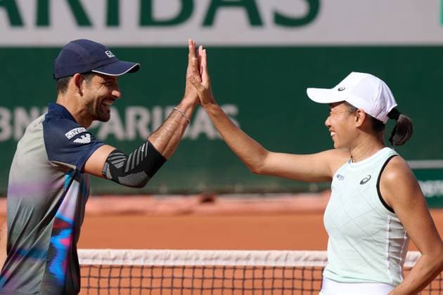 (240604) -- PARIS, June 4, 2024 -- Zhang Shuai (R) Marcelo Arevalo celebrate the victory after the mixed doubles second round match between Zhang Shuai (China) Marcelo Arevalo (El Salvador) and Asia Muhammad(USA) Ariel Behar(Uruguay) at the French Open tennis tournament at Roland Garros in Paris, France, June 3, 2024. ) (SP)FRANCE-PARIS-TENNIS-FRENCH OPEN-MIXED DOUBLES MengxDingbo 