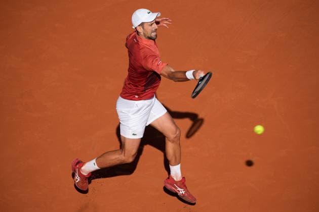 (240604) -- PARIS, June 4, 2024 -- Novak Djokovic hits a return during the men s singles fourth round match between Novak Djokovic of Serbia and Francisco Cerundolo of Argentina at the French Open tennis tournament at Roland Garros, Paris, France, June 3, 2024. ) (SP)FRANCE-PARIS-TENNIS-FRENCH OPEN-MEN S SINGLES MengxDingbo 