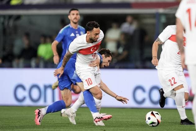 Italy s Federico Chiesa fights for the ball with Turkiye s Hakan Calhanoglu during the Friendly Matches 2024 between Italy and Turkiye at Renato Dall& x2019;Ara Stadium - Soccer - Bologna, Italy - Tuesday June 4, 2024  Copyright: xMassimoxPaolone LaPressex