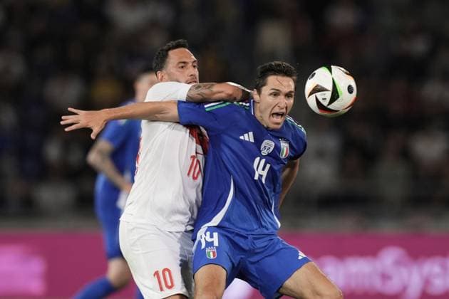 Italy s Federico Chiesa fights for the ball with Turkiye s Hakan Calhanoglu during the Friendly Matches 2024 between Italy and Turkiye at Renato Dall& x2019;Ara Stadium - Soccer - Bologna, Italy - Tuesday June 4, 2024  Copyright: xMassimoxPaolone LaPressex