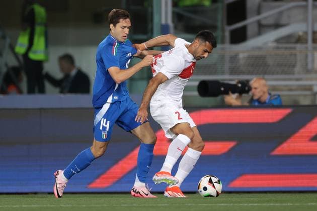 Bologna, Italy, 4th June 2024. Federico Chiesa of Italy tussles with Zeki Celik of Turkey during the International Friendly, Länderspiel, Nationalmannschaft match at Stadio Renato Dall Ara, Bologna. Picture credit should read: Jonathan Moscrop Sportimage EDITORIAL USE ONLY. No use with unauthorised audio, video, data, fixture lists, club league logos or live services. Online in-match use limited to 120 images, no video emulation. No use in betting, games or single club league player publications. SPI-3179-0015