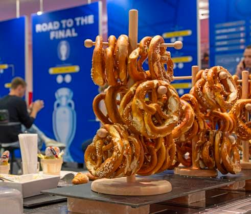 30 05 2024, European Football Championship 2024, The European Championship stadium Munich Football Arena, thats the name of the Allianz Arena Munich during the European Championship, Traditional meal, Pretzels in the press room at the press conference