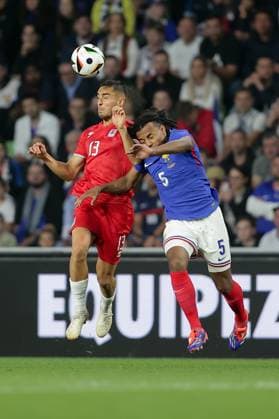 Head-to-head duel between Dirk Carlson Luxembourg 13 and Jules KoundÃ France 5 Football, Season 20223 2024, Friendly match, International match 05 06 2024 National team France Luxembourg France vs Luxembourg Stade Saint Symphorien, Metz