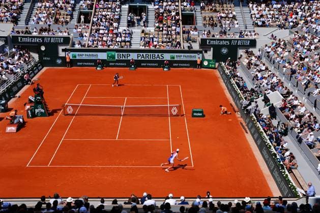 An artist paints courtside, bottom right, during the semi final between Coco Gauff and Iga Swiatek French Open Tennis, Day 12, Tennis, Roland Garros, Paris, France - 06 June 2024  Copyright: xJavierxGarcia Shutterstockx 14521936s