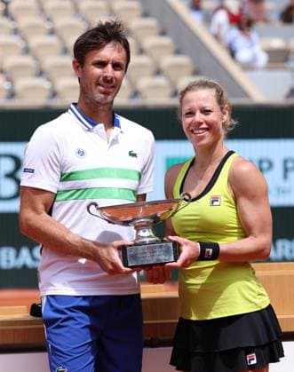 (240606) -- PARIS, June 6, 2024 -- Laura Siegemund (R) of Germany Edouard Roger-Vasselin of France pose with the trophy during the awarding ceremony after the mixed doubles final between Desirae Krawczyk of USA Neal Skupski of Britain and Laura Siegemund of Germany Edouard Roger-Vasselin of France at the French tennis tournament at Roland Garros in Paris, France, June 6, 2024. ) (SP)FRANCE-PARIS-TENNIS-FRENCH OPEN-MIXED DOUBLES-FINAL GaoxJing 