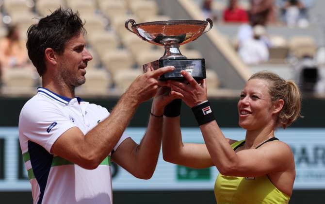 (240606) -- PARIS, June 6, 2024 -- Laura Siegemund (R) of Germany Edouard Roger-Vasselin of France hold up the trophy during the awarding ceremony after the mixed doubles final between Desirae Krawczyk of USA Neal Skupski of Britain and Laura Siegemund of Germany Edouard Roger-Vasselin of France at the French tennis tournament at Roland Garros in Paris, France, June 6, 2024. ) (SP)FRANCE-PARIS-TENNIS-FRENCH OPEN-MIXED DOUBLES-FINAL GaoxJing 