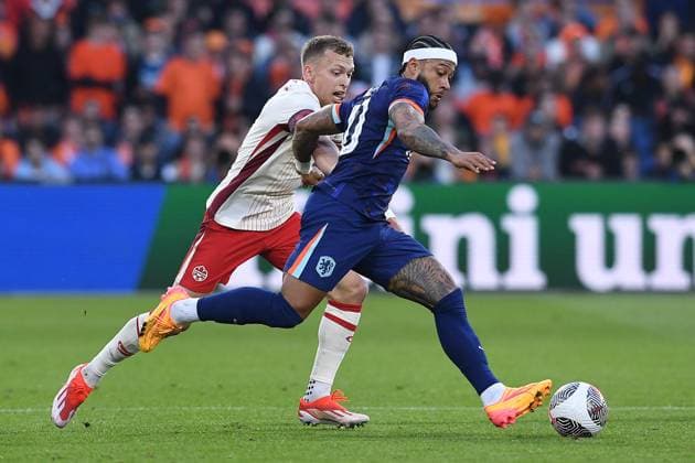 International soccer match Netherlands Canada on 06 06 2024 at Feyenoord Stadium in Rotterdam Memphis Depay Netherlands , front Alistair Johnston Canada , back xRx