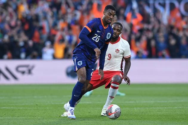 International soccer match Netherlands Canada on 06 06 2024 at Feyenoord Stadium in Rotterdam Ryan Gravenberch Netherlands , front Cyle Larin Canada , back xRx