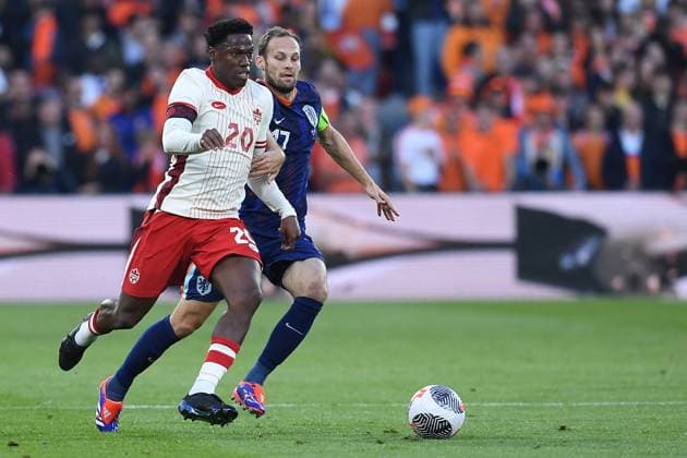 International soccer match Netherlands Canada on 06 06 2024 at Feyenoord Stadium in Rotterdam Jonathan David Canada , front Daley Blind Netherlands , back xRx