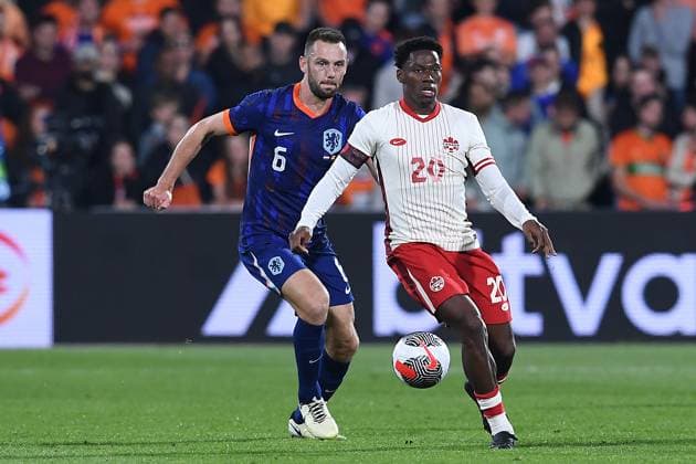 International soccer match Netherlands Canada on 06 06 2024 at Feyenoord Stadium in Rotterdam Jonathan David Canada , front Stefan de Vrij Netherlands , back xRx