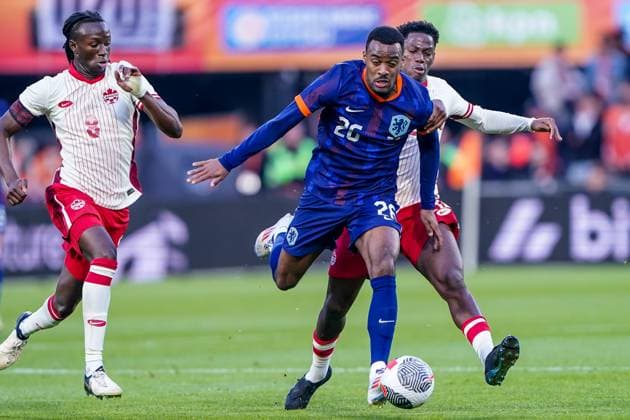 2024-06-06 Netherlands v Canada - Friendly International ROTTERDAM, NETHERLANDS - JUNE 6: Ryan Gravenberch of Netherlands battles for the ball with Jonathan David of Canada during the Friendly international match, Länderspiel, Nationalmannschaft between Netherlands and Canada at Stadion Feijenoord de Kuip on June 6, 2024 in Rotterdam, Netherlands. (Photo by Andre Weening BSR Agency) Rotterdam Netherlands Content not available for redistribution in The Netherlands directly or indirectly through any third parties. Copyright: xBSRxAgencyx