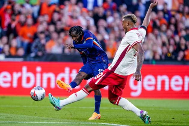 2024-06-06 Netherlands v Canada - Friendly International ROTTERDAM, NETHERLANDS - JUNE 6: Jeremie Frimpong of Netherlands shoots to score Derek Cornelius of Canada is to late during the Friendly international match, Länderspiel, Nationalmannschaft between Netherlands and Canada at Stadion Feijenoord de Kuip on June 6, 2024 in Rotterdam, Netherlands. (Photo by Andre Weening BSR Agency) Rotterdam Netherlands Content not available for redistribution in The Netherlands directly or indirectly through any third parties. Copyright: xBSRxAgencyx