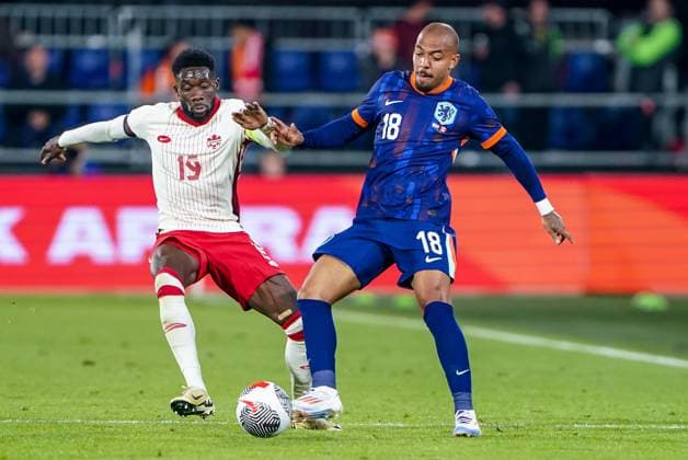 2024-06-06 Netherlands v Canada - Friendly International ROTTERDAM, NETHERLANDS - JUNE 6: Donyell Malen of Netherlands battles for the ball with Alphonso Davies of Canada during the Friendly international match, Länderspiel, Nationalmannschaft between Netherlands and Canada at Stadion Feijenoord de Kuip on June 6, 2024 in Rotterdam, Netherlands. (Photo by Andre Weening BSR Agency) Rotterdam Netherlands Content not available for redistribution in The Netherlands directly or indirectly through any third parties. Copyright: xBSRxAgencyx