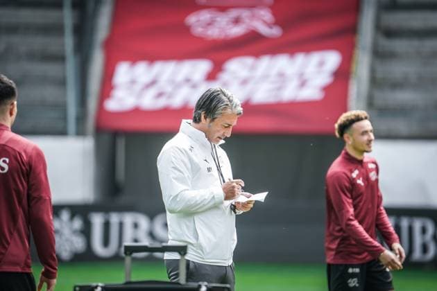 Soccer St Gallen, Switzerland Kick-off training national team Switzerland training before the last test match against Austria in Kybunpark SUI, AUT, friendly match, UEFA EURO 2024, Nati Suisse national coach Murat Yakin writes, studies, reads, pensive, observing on the pitch St Gallen Kybunpark Switzerland Copyright: xJoeranxSteinsiekx