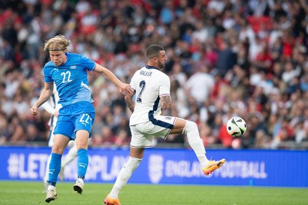 Kyle Walker of England (in white) wins the ball ahead of Andri GuÃ°johnsen of Iceland during the international match, Länderspiel, Nationalmannschaft between England and Iceland at Wembley Stadium, London, England on 7 June 2024. Copyright: xGrantxWinterx 41140033