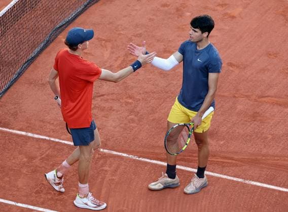 Carlos Alcaraz of Spain (R) shakes hands with Jannik Sinner of Italy at the end of their semi-final match at the French Tennis Open in Roland Garros in Paris, France, on Friday, June 7, 2024. Alcaraz won 2-6, 6-3, 3-6, 6-4, 6-3 and qualified for the final.  PAR20240607131 MAYAxVIDON-WHITE