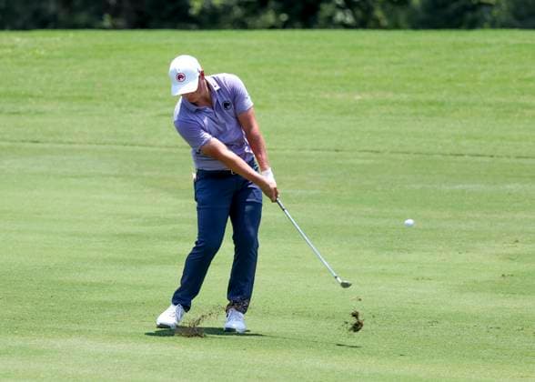 HUMBLE, TX - JUNE 07: Caleb Surratt (USA) hits his approach shot on 10 during the first round of the LIV Golf Houston tournament on June 7, 2024 at Golf Club of Houston in Humble, Texas (Photo by Leslie Plaza Johnson Icon Sportswire) GOLF: JUN 07 LIV Golf League Houston EDITORIAL USE ONLY Icon2406070401