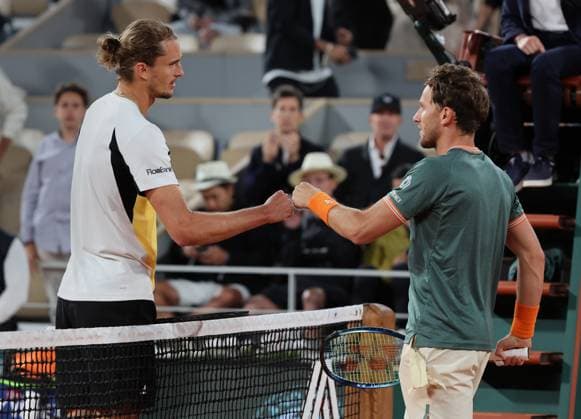 Alexender Zverev of Germany (L) and Casper Ruud of Norway shake hands at the end of their semi-final match at the French Tennis Open in Roland Garros in Paris, France, on Friday, June 7, 2024. Zverev won 6-2, 2-6, 6-4, 6-2 and qualified for the final.  PAR20240607157 MAYAxVIDON-WHITE