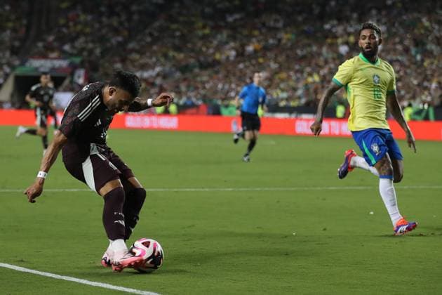 June 8, 2024, College Station, Texas, USA: MexicoÃ¢â‚¬â ¢s ALEXIS VEGA (10) drives prepares to kick the ball for MexicoÃ¢â‚¬â ¢s first goal as BrazilÃ¢â‚¬â ¢s DOUGLAS LUIS DE PAULO (18) attempts to defend during the 2024 Mex Tour friendly soccer match between Mexico and Brazil at Kyle Field in College Station on Saturday. College Station USA - ZUMAm257 20240608_zsp_m257_012 Copyright: xBrianxMcLeanx