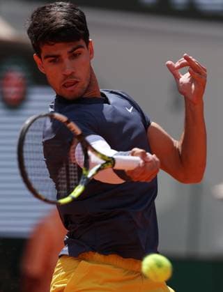 (240609) -- PARIS, June 9, 2024 -- Carlos Alcaraz hits a return during the men s singles final between Carlos Alcaraz of Spain and Alexander Zverev of Germany at the French tennis tournament in Paris, France, June 9, 2024. ) (SP)FRANCE-PARIS-TENNIS-FRENCH OPEN-MEN S SINGLES FINAL GaoxJing 
