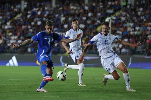 Empoli, Italy, 9th June 2024. Gianluca Scamacca of Italy fires golwards as Nikola Katic of Bosnia and Herzegovina closes in during the International Friendly, Länderspiel, Nationalmannschaft match at Stadio Carlo Castellani, Empoli. Picture credit should read: Jonathan Moscrop Sportimage EDITORIAL USE ONLY. No use with unauthorised audio, video, data, fixture lists, club league logos or live services. Online in-match use limited to 120 images, no video emulation. No use in betting, games or single club league player publications. SPI-3180-0051