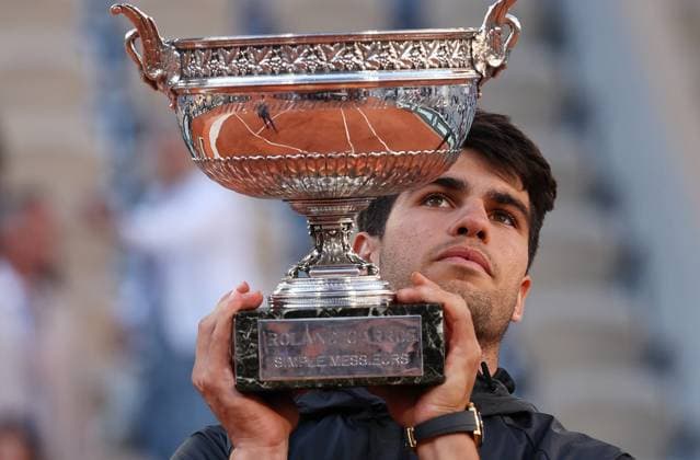 (240610) -- PARIS, June 10, 2024 -- Carlos Alcaraz holds the trophy during the awarding ceremony after the men s singles final match between Carlos Alcaraz of Spain and Alexander Zverev of Germany at the French Open tennis tournament at Roland Garros, Paris, France, June 9, 2024. ) (SP)FRANCE-PARIS-TENNIS-FRENCH OPEN-MEN S SINGLES-FINAL GaoxJing 
