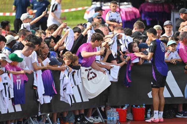Jamal MUSIALA GER signs autographs for the fans,Football fans public training, German national football team,training camp in Herzogenaurach on 10 06 2024