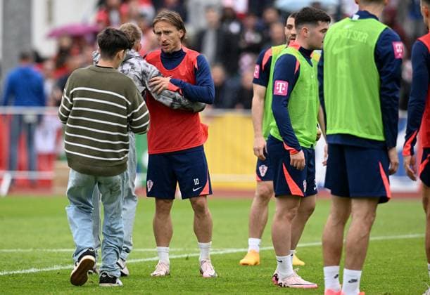 Croatia national team, Nationalteam Training Session Luka Modric of Croatia is pictured as he hugs a fan who run into pitch during a training session at UEFA EURO, EM, Europameisterschaft,Fussball 2024 Croatia base camp in Neuruppin, Germany on June 10, 2024. MarkoxLukunic PIXSELL