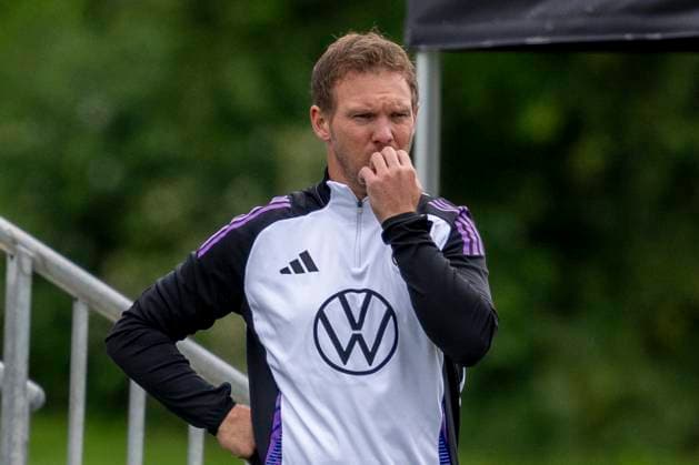 National football team, training on 11 06 2024 in Herzogenaurach National coach Julian Nagelsmann ponders Important note According to FIFA or UEFA regulations, it is prohibited to use or have used photographs taken in the stadium and or of the match in the form of sequential images and or video-like photo series Foto Kirchner Media DI Copyright: xKirchner-Media DIx